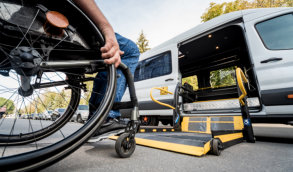 man on a wheelchair going in a van