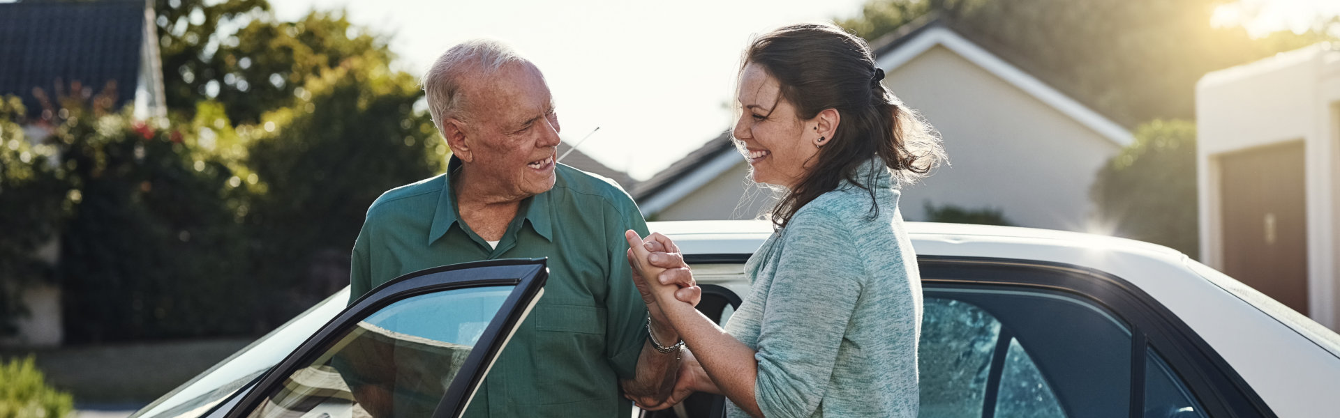 Travel, transportation and happy women helping elderly male person from motor vehicle for service